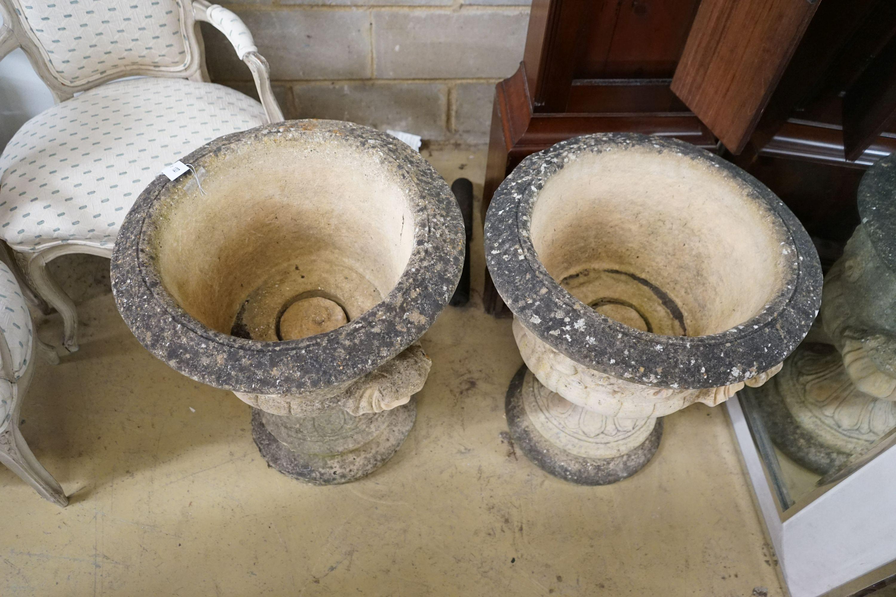 A pair of large circular reconstituted stone garden planters, diameter 56cm, height 63cm